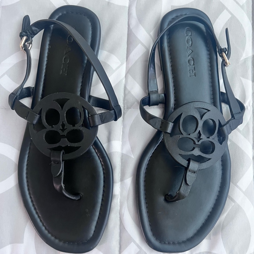 Flat black coach sandals